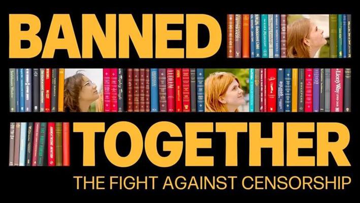 Graphic featuring rows of colourful book spines arranged like shelves. Large bold yellow text reads “BANNED TOGETHER” across the top and “TOGETHER” across the bottom. Smaller text underneath reads “THE FIGHT AGAINST CENSORSHIP”. Two people are partially visible between the books, looking upward. The background is black.